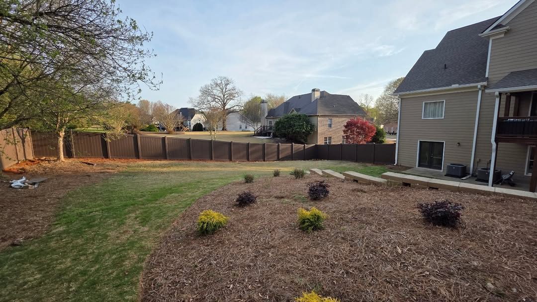 Brown vinyl privacy fence
