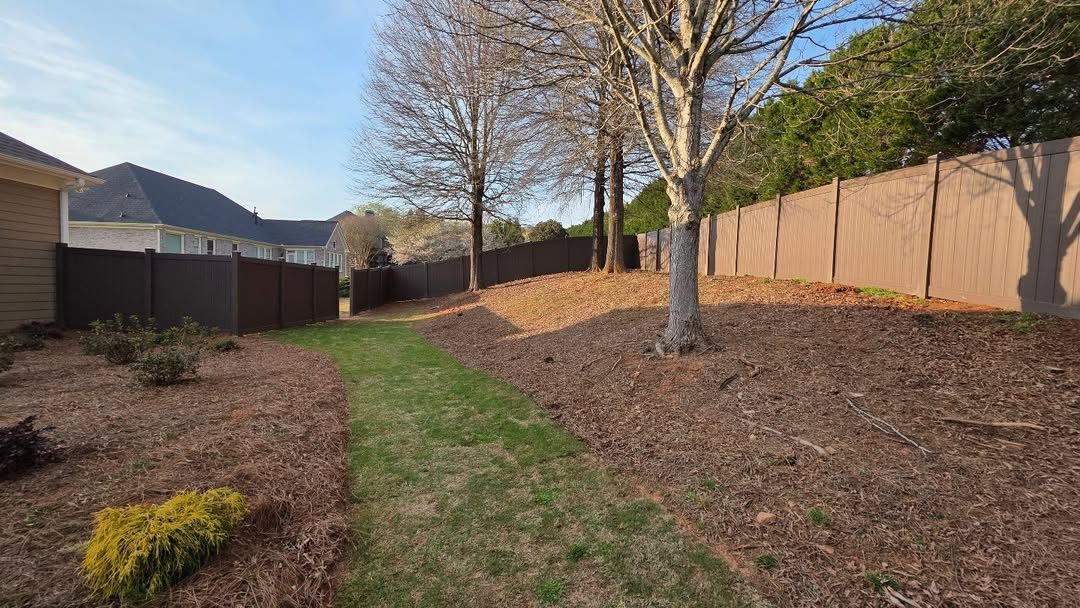 Brown vinyl privacy, wooded lot