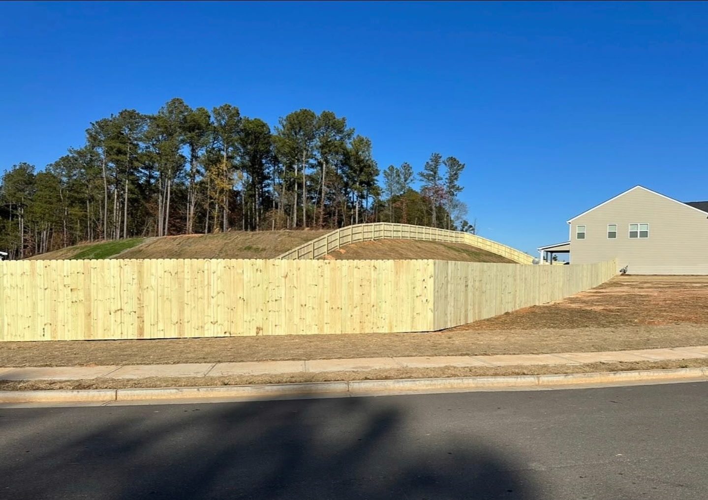 Privacy fence following the hillside